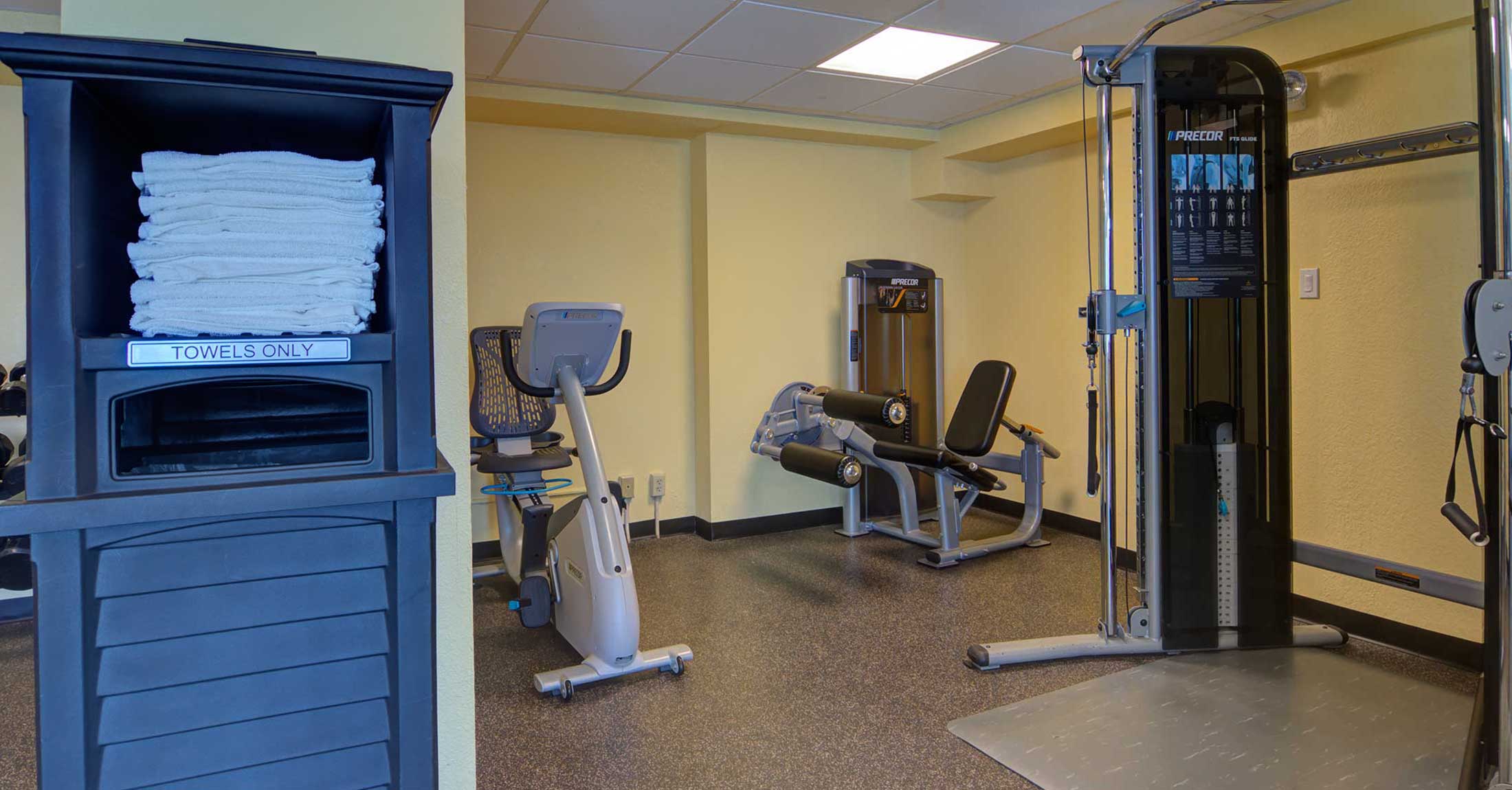 fitness center strength machines and stationary bike