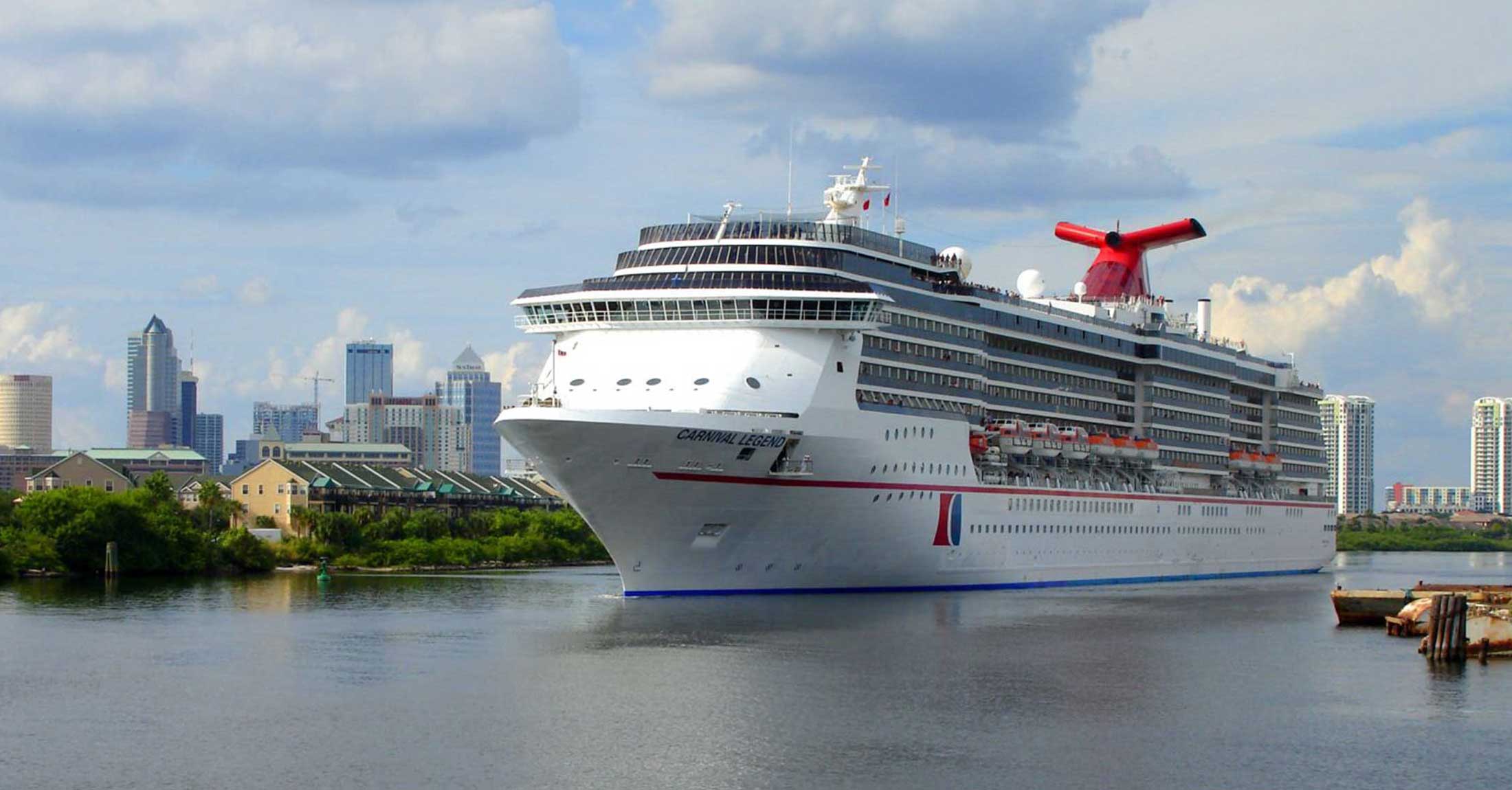 cruise ship docked at port tampa bay with downtown tampa in the distance