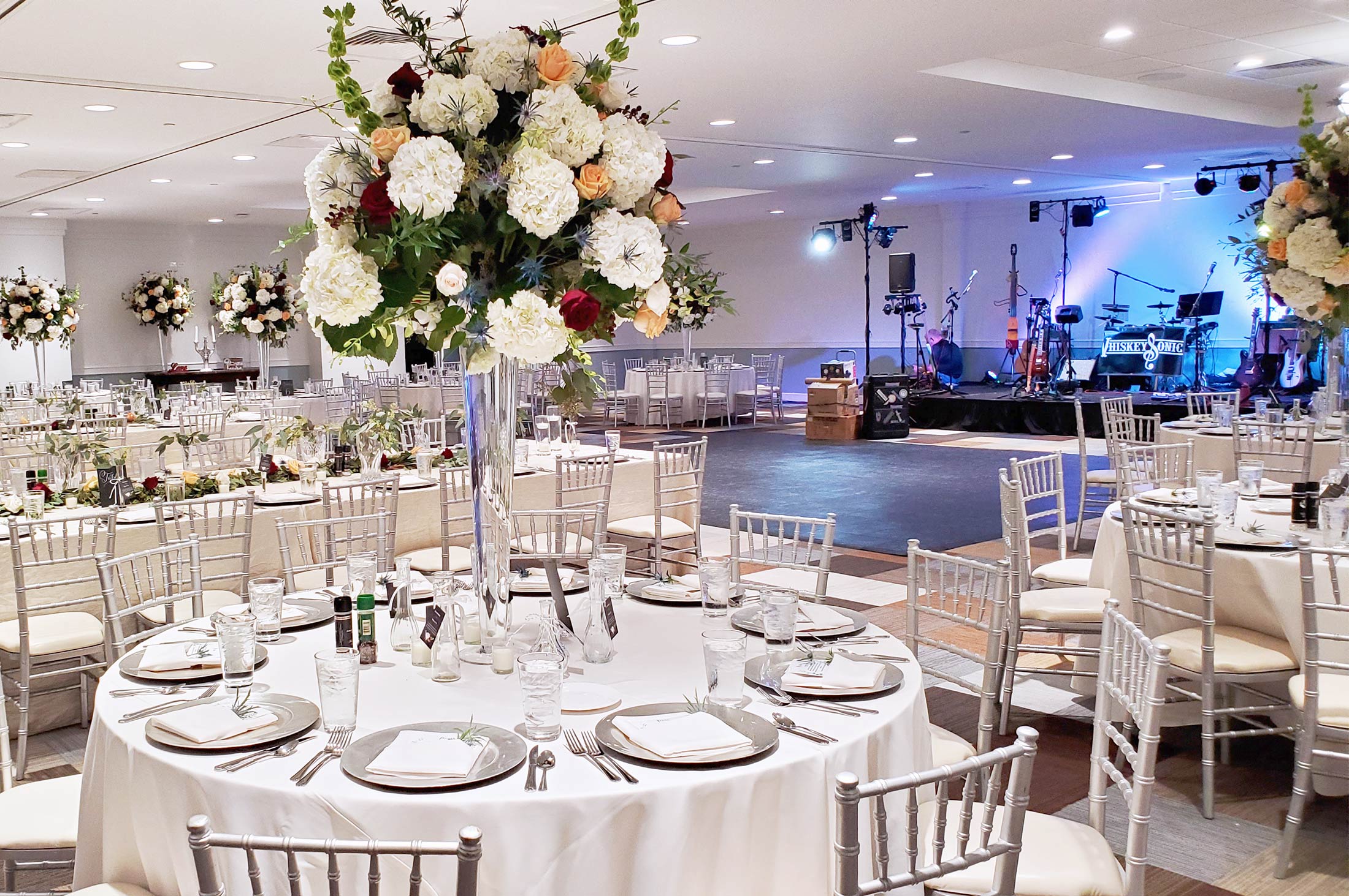 closeup of place settings and long reception tables